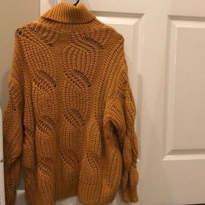 Mustard yellow sweater.